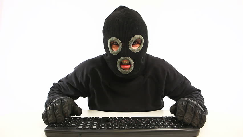 guy in balaclava and black gloves typing something in anger and go away
