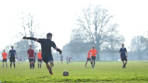 BRISTOL - March 16: Football (Soccer) Match in Park: Goalkeeper Kicks Ball (Super Slow Motion) - March 16 2017 in Bristol England
