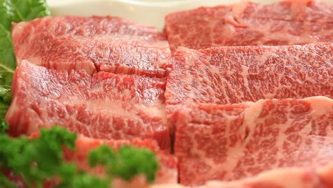 raw red meat : fresh beef  on  plate .
