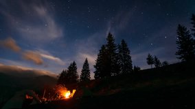 Moving stars above tent at night. Overnight in wild areas. Dramatic and gorgeous scene. Location Carpathian Ukraine Europe. Explore the world's beauty. Time lapse, interval shooting in HD 1080 video.