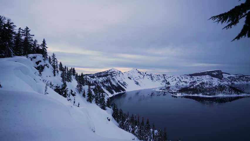 Camera Pans, From Left To Right, Wide Angle View Of Crater Lake At Sunset In Winter (Crater Lake National Park In Oregon, USA)