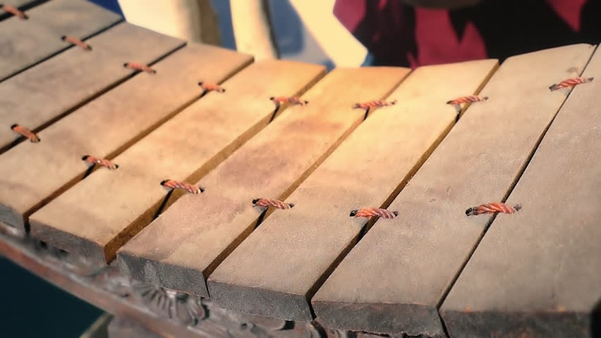 Playing traditional Thai musical instrument Ranat Ek in slow motion