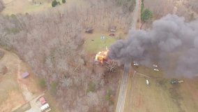aerial footage of fire department fighting house fire