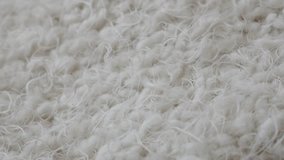 White scarf winter clothing surface shallow DOF 4K 2160p 30fps UltraHD panning footage - Shaggy material fibers and texture 3840X2160 UHD video