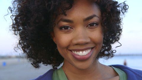 Portrait of woman smiling at beach Stock Video