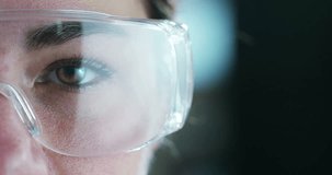A woman watches with a futuristic look with glasses. augmented reality in holography. 
