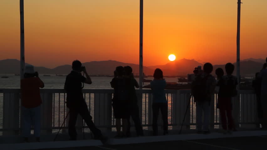 Photographers ready to take a sunset picture