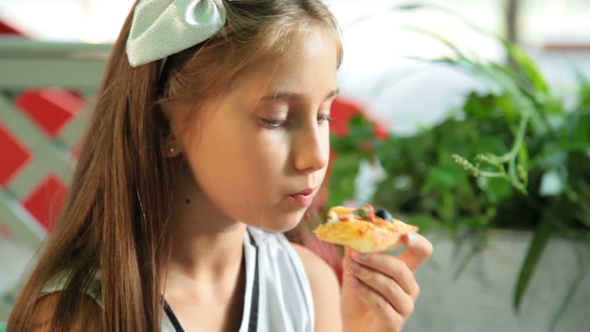 Little Girl Eating Pizza In Stock Footage Video 100 Royaltyfree