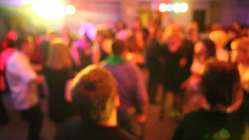 crowd of smart people dancing in disco lights