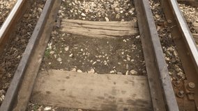 Corroded railroad walk with lot of details slow motion 1920X1080 HD footage - POV scene  of rails covered with stone and wooden ties slow-mo 1080p FullHD video