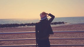 Young Woman In Hat Looking At The Sea - 4K Video