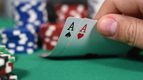 Poker Players Checking Cards, Holding Two Aces. Slow Motion Effect