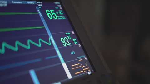 View of a hospital monitor in a dark hospital room