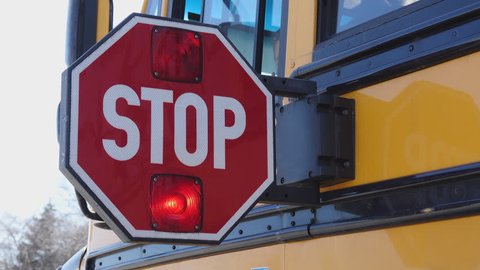 School bus stop paddle being turned off
