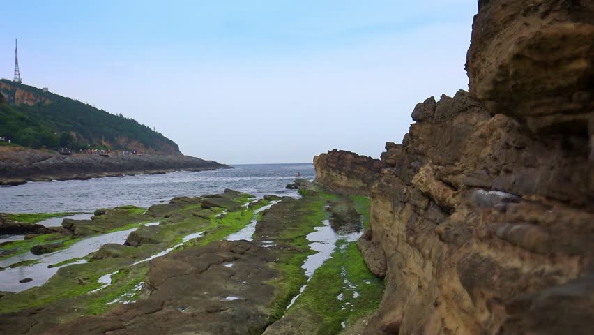 4K beautiful coastal landscape of Yehliu Geopark at Wanli of New Taipei City of Taiwan. Mushroom-shaped rock strange rocky landscape. Honeycomb stone erosion disk-Dan