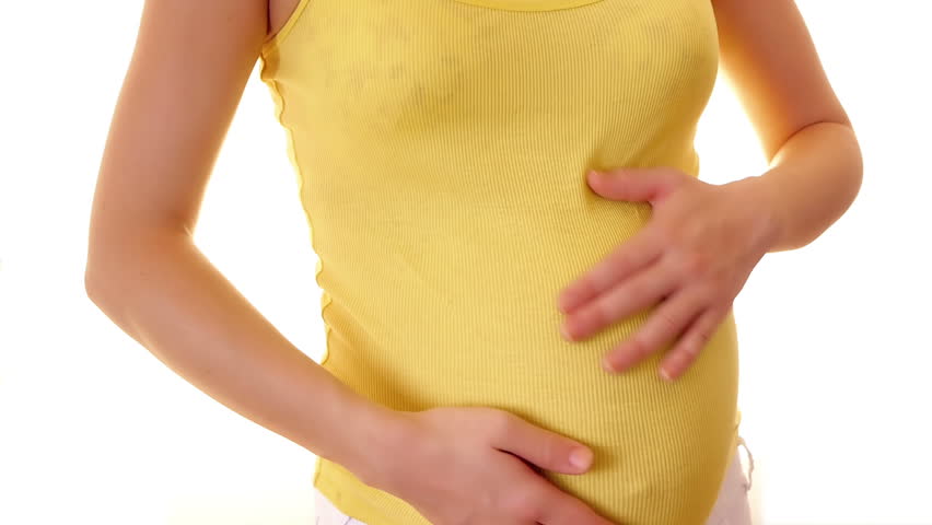 Woman touching her pregnant belly
