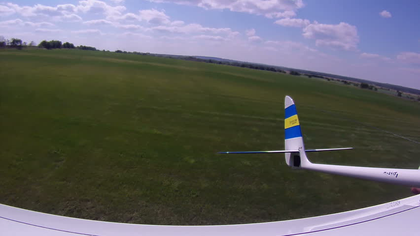 Flying over the Countryside, Bird's-eye, look back. Extreme camera is mounted on