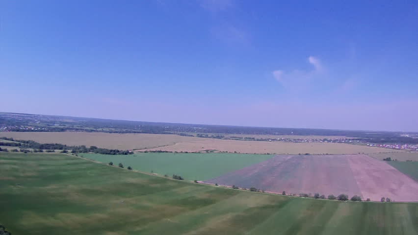 Flying over the Countryside, Bird's-eye. Extreme camera is mounted on the wing