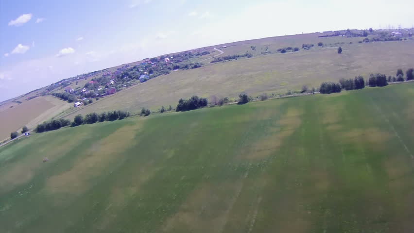 Flying over the Countryside, Bird's-eye. Extreme camera is mounted on the wing