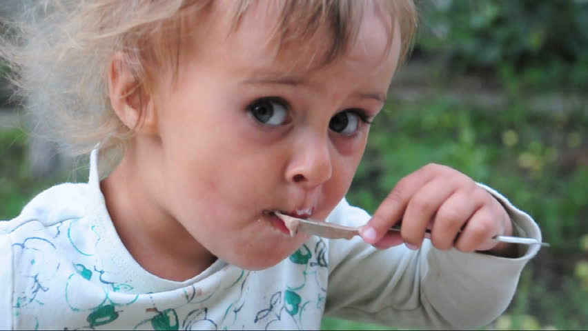 toddler eating spoon