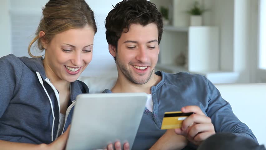 Young couple at home buying on internet
 Royalty-Free Stock Footage #2498489
