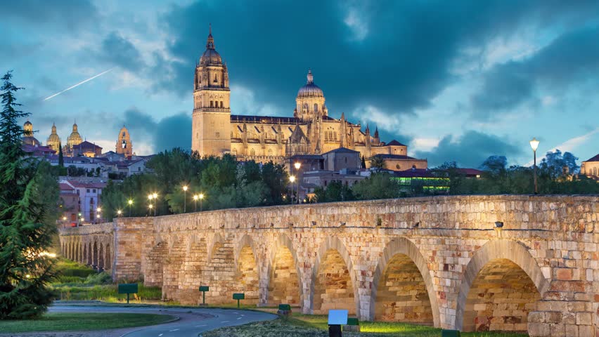 Romana Bridge with New Cathedral at the background in the evening, Salamanca, Spain (static image with animated sky)
