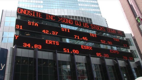 New York, NY - CIRCA March 2006: A wide shot of an electronic billboard that scrolls the days current stock prices