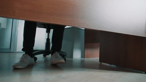 Legs under the desk Stock Video Footage - 4K and HD Video Clips ...