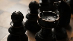 Ancient chess set figures arranged on playing table close-up 4K 2160p 30fps UltraHD  footage - Wooden black player chessman on chequered fields 3840X2160 UHD video