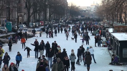AMSTERDAM - FEBRUARY 11 2012: People are spending a day on the ice during a beautiful winter day in Amsterdam