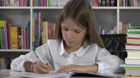 4K Student Child Writing Studying in Library Learning School Girl at Desk Office
