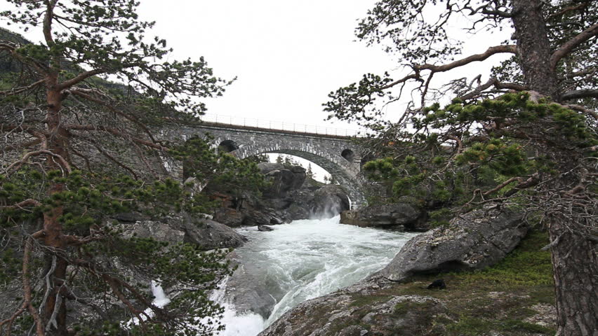 Old railroad bridge crossing waterfall