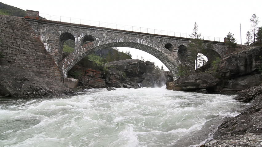 Old railroad bridge crossing waterfall