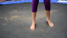 video of child jump on trampoline