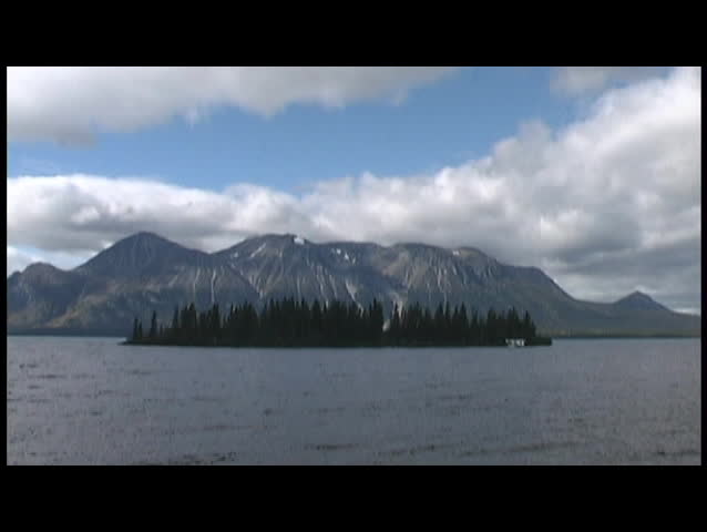 Scenery of an island and float plane on a lake in Atlin,  Canada.