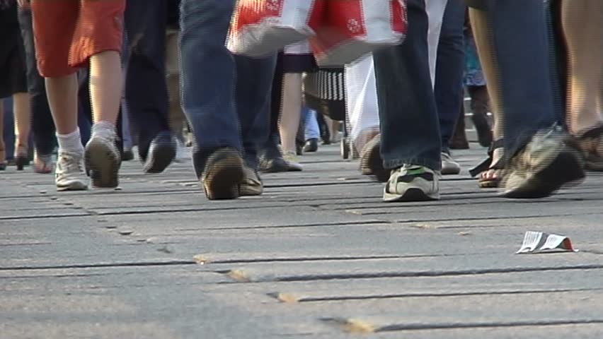 People walking on busy street.