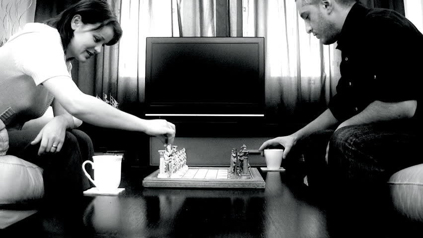 Couple playing chess,time lapse during the game and slow motion at the end