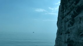 This is a beautiful natural video of Blue Sea And Rock High Definition. 
