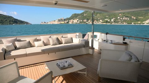 Living area on a luxury yacht docked in the bay in front of Portovenere, Italy
