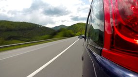 Driving on the highway in the mountains. Time lapse.