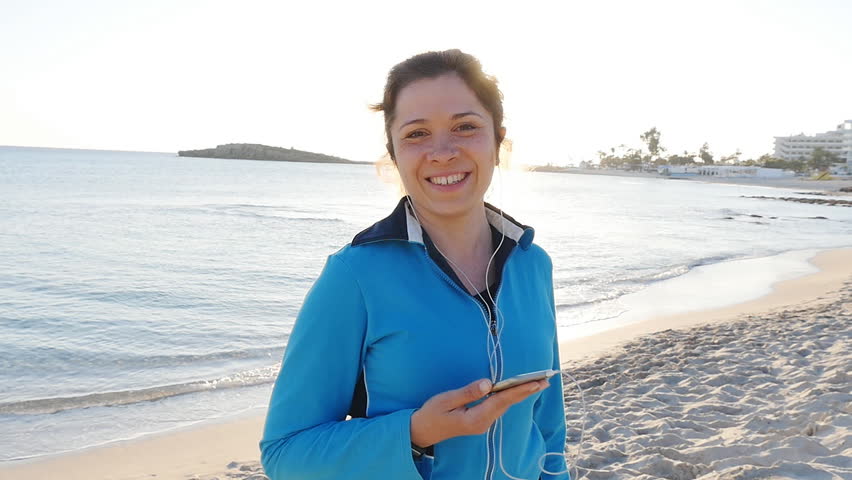 Sporty fitness woman on beach