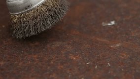Cleaning a rusty metal sheet with a metal brush - Powered by Shutterstock - Get 15% off with code: PIKWIZARD15
