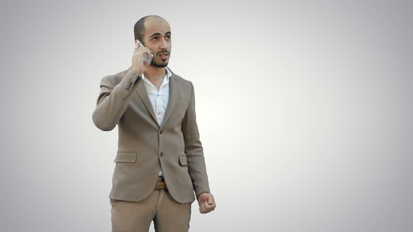 Young man talking on the phone and actively gesturing on white background.