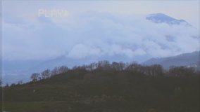 Fake VHS tape: timelapse of a mountain view in the morning. Snow-capped peaks and green bushes.
 - Powered by Shutterstock - Get 15% off with code: PIKWIZARD15