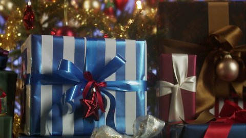 Presents by a Christmas tree. Stock Video