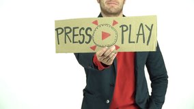 Press Play placeholder or intro video for any video clips used on social media feeds, man holding a cardboard sign with a big red play button