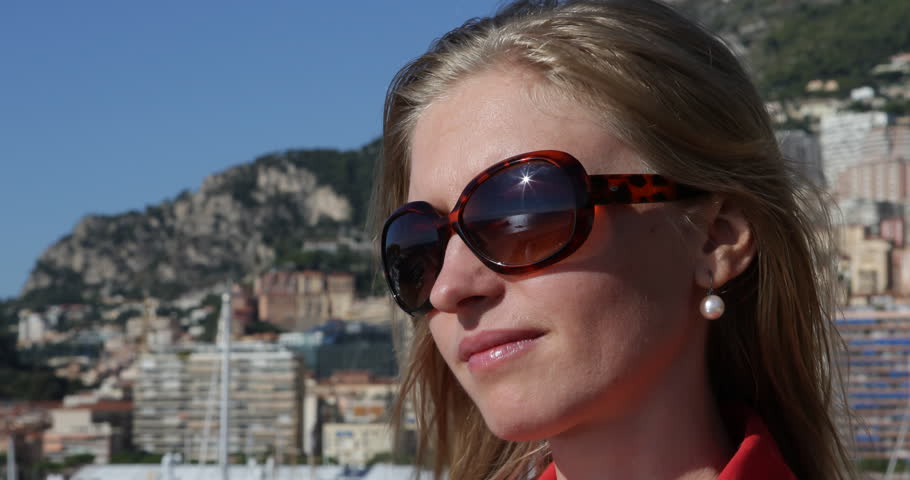 4K Closeup of girl young woman looking camera, cityscape of Monaco city admire