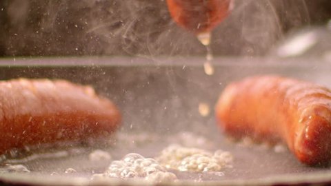 Cooking Sausages - Slow motion shot