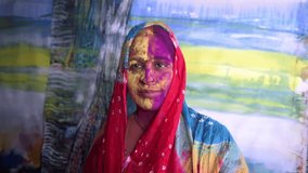 Mumbai / India 13 March 2017 An Indian woman's face is smeared with colored powder during celebrations of the Holi festival. at malad Mumbai Maharashtra India