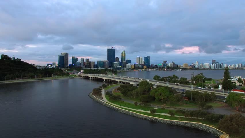 Aerial footage of Perth city, Western Australia, looking across the Swan River from South Perth on dusk.